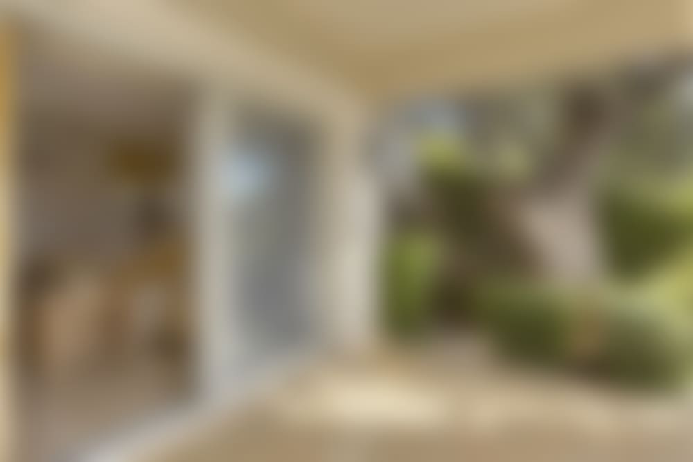 The same bedroom seen from its area of terrace.